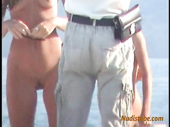 Young Nudist Mom is talking to strangers