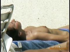 Spying after topless women on the beach