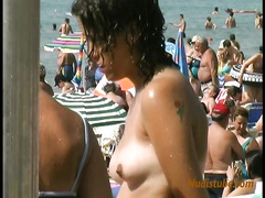 Topless girls on public beach