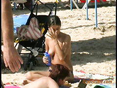 Topless girls on public beach