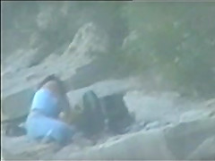 teen couple caught on the beach