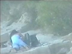 teen couple caught on the beach