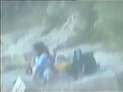 teen couple caught on the beach