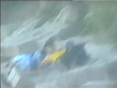 teen couple caught on the beach