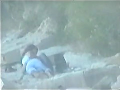 teen couple caught on the beach