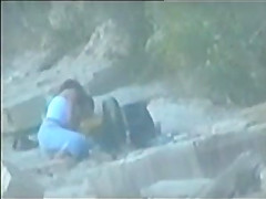 teen couple caught on the beach