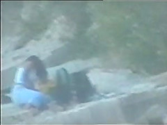 teen couple caught on the beach