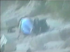 teen couple caught on the beach