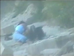 teen couple caught on the beach