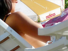 Hidden cam on beach topless brunette