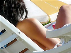 Hidden cam on beach topless brunette