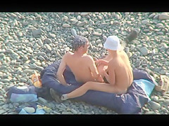 Voyeur on public beach. Oral sex