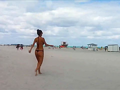 Beautiful girl with small bikini thong !