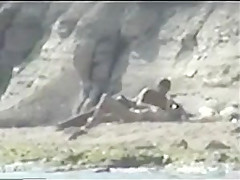 Shy couple caught on the nudist beach