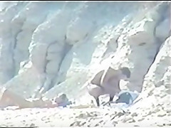 Shy couple caught on the nudist beach