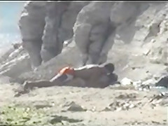 Shy couple caught on the nudist beach