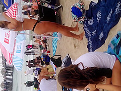 Blonde black thong on beach