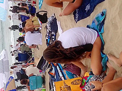 Blonde black thong on beach