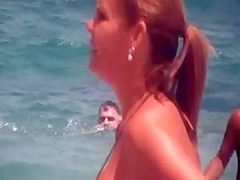 sexy mature thong bikini with NOT her daughter on beach 2014