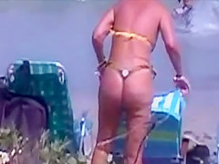 sexy mature thong bikini with NOT her daughter on beach 2014