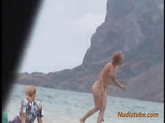 Girls leaving the nude beach in the evening