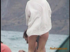 Girls leaving the nude beach in the evening