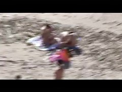 Voyeur on public beach. Group sex before spectators