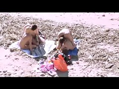 Voyeur on public beach. Group sex before spectators