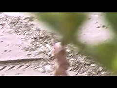Voyeur on public beach. Group sex before spectators