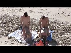 Voyeur on public beach. Group sex before spectators