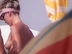 Very horny milf rubbing boobs in nude beach