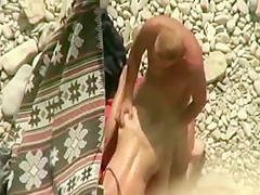 Spying horny couple on the beach