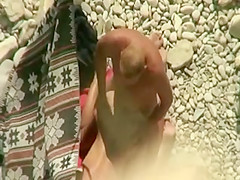 Spying horny couple on the beach