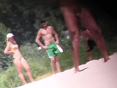 Nude Tanya playing frisbee on the beach