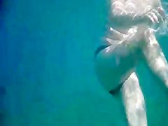 Topless thick MILF under the water for voyeurs