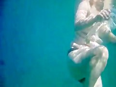 Topless thick MILF under the water for voyeurs