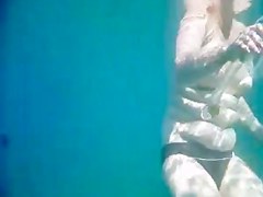 Topless thick MILF under the water for voyeurs