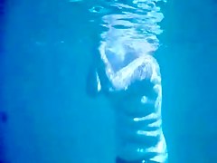 Topless thick MILF under the water for voyeurs