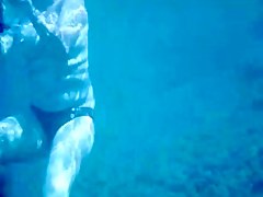 Topless thick MILF under the water for voyeurs