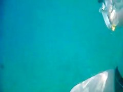 Topless thick MILF under the water for voyeurs