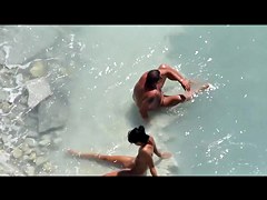 Slim tanned girl lying, legs spread got slippers on pussy