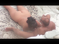 Mature woman does blowjob man and has sex on a public beach