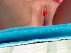 Pierced clit on the beach