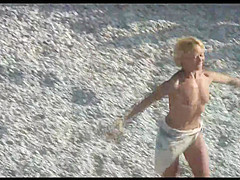 Voyeur on public beach. Funny dancing