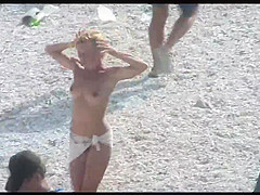 Voyeur on public beach. Funny dancing