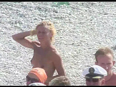 Voyeur on public beach. Funny dancing