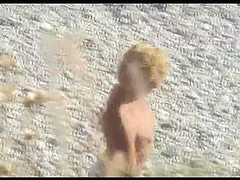 Voyeur on public beach. Funny dancing