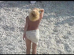 Voyeur on public beach. Funny dancing
