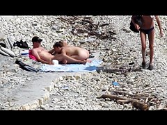 Couple fucked on a public beach while as people walked near