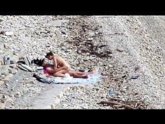 Couple fucked on a public beach while as people walked near